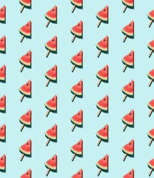 Watermelon popsicle on blue seamles pattern Stock Photos