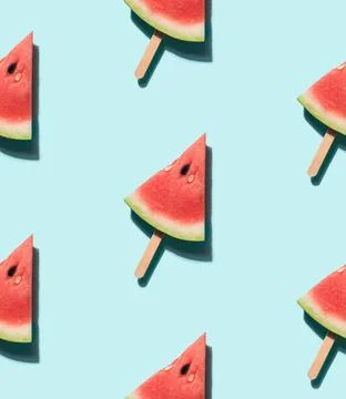 Watermelon popsicle on blue seamles pattern watermelon popsicle seamless p... Stock Photos