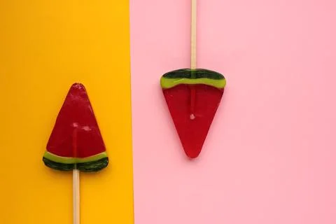 Watermelon popsicle on colored backdrop. Stock Photos
