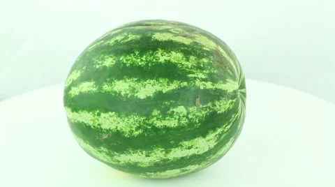 Watermelon rotates on a white background Stock Footage 50032983