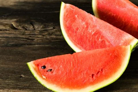 The watermelon on a rustic wooden table background Stock Photos