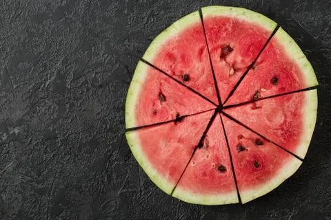 Watermelon Slice on Dark Stone Table. Summer Background Stock Photos