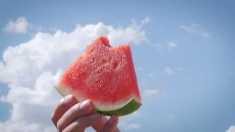 Watermelon Slice Isolated Against Summer Sky Stock Footage 79381350