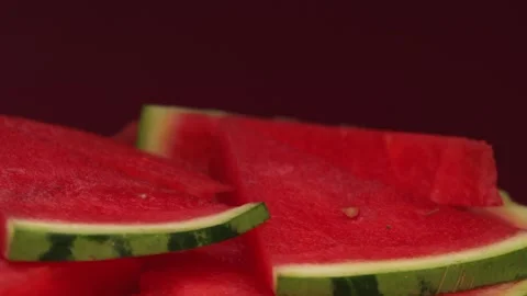 Watermelon slice with peel, rotation in circle. juicy red triangles watermelon Stock Footage 252796829