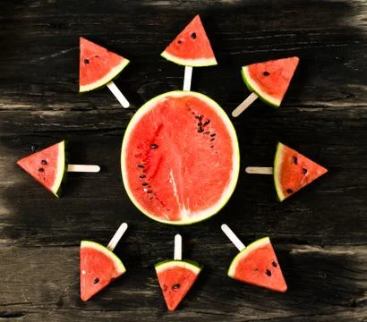 The watermelon slice popsicles on a rustic wood background. copy space for .. Stock Photos