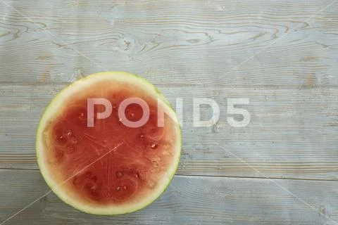 Watermelon slice on wood with copy space Stock Photos