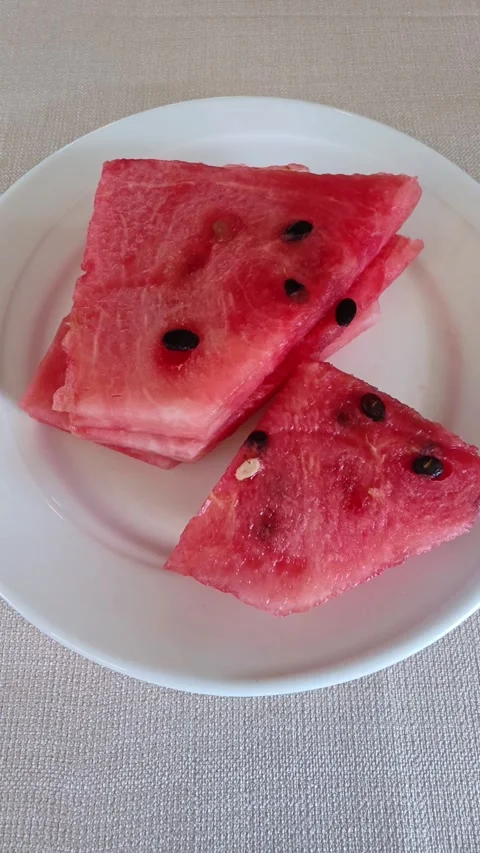 Watermelon sliced ​​in a white plate. Stock Footage 320947899