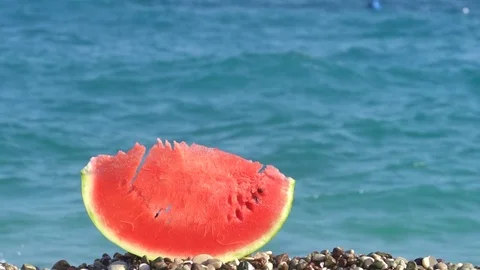 Watermelon In Slices on the beach Stockbeeldmateriaal 80377423