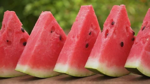 Watermelon slices in a row on the table - close up Stock Footage 154203927