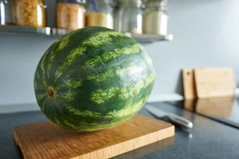 Watermelon on the table in the kitchen. Close-up. Stock Photos