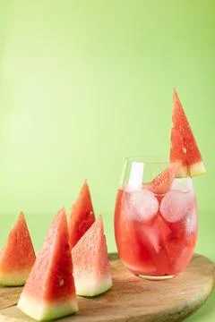 Watermelon triangles and a soft drink with ice and chunks of watermelon Stock Photos