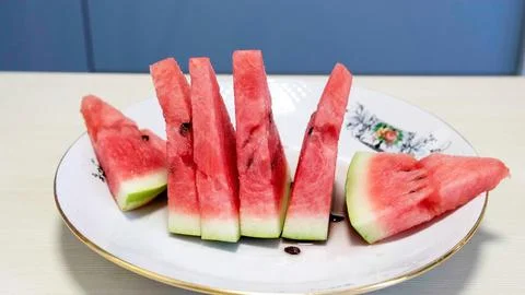 Watermelon triangular pieces of watermelon on the background Stock Photos