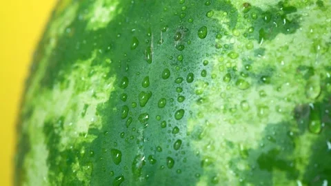 Watermelon water drop on yellow background Stock Footage 156842633