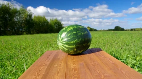 Watermelon on a wooden table. Stock Footage 32362366