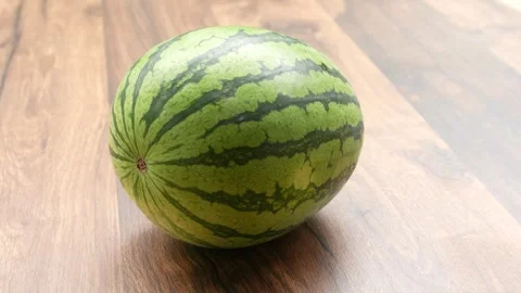 Watermelon on a wooden table 스톡 동영상 249958537