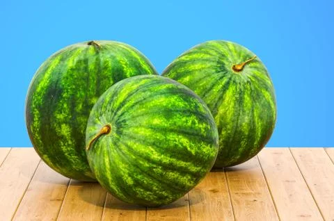 Watermelons 3d rendering with realistic texture on the wooden table Stock Illustration