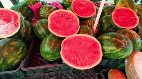 Watermelons and melons in plastic boxes at the market. 스톡 동영상 314947541