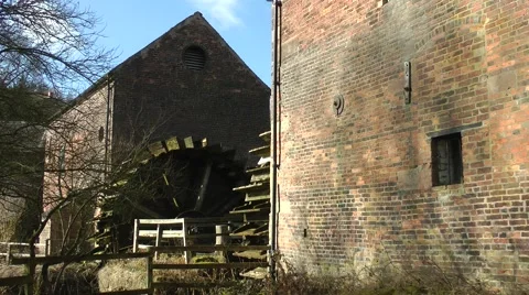 Watermill water wheel red bricks old vintage heritage Stock Footage 47372446