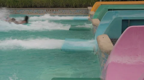 Waterpark Slides Splashing Into Pool Stock Footage 31922995