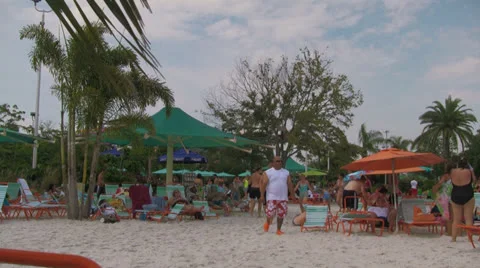 Waterpark Visitors Walking around Man-made Beach Stock Footage 24684191