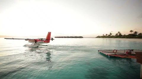 Waterplane leaving jetty Stock Footage 1018484