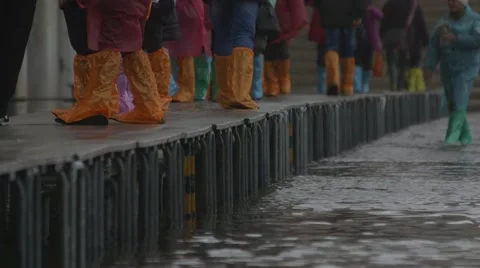 Waterproof boots on flooded footpaths, st mark's, venice, italy - sea level rise Stock Footage 45542687