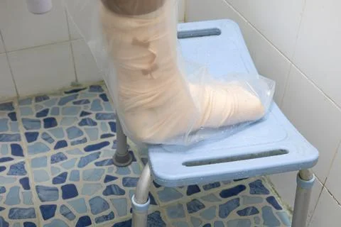 Waterproof protector for cast while showering Stock Photos