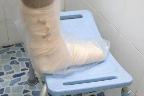 Waterproof protector for cast while showering Stock Photos