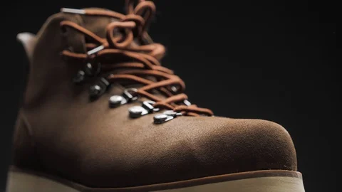 A waterproof spray is applied to the shoes Stock Footage 117638909