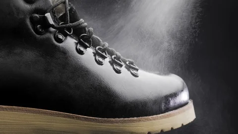 A waterproof spray is applied to the shoes Video stock 117639042