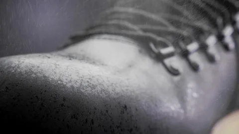 A waterproof spray is applied to the shoes Stock Footage 117639107