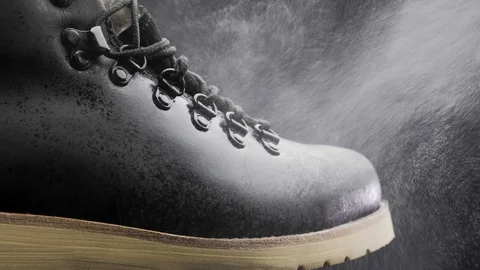 A waterproof spray is applied to the shoes Stock Footage 118938029