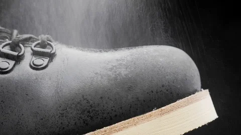 A waterproof spray is applied to the shoes Stock-Footage 118938087
