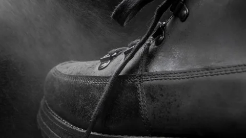 A waterproof spray is applied to the shoes Stock Footage 118938130