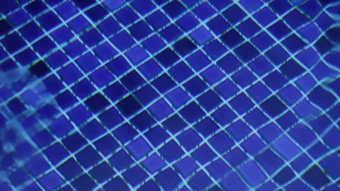 Water's drop falling in a swimming pool Stock Footage 75277589