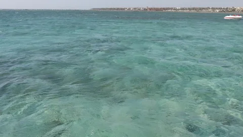 Water's Edge Deserted Beach. Closeup of waves on a deserted beach of the Red Sea Stock Footage 117578673