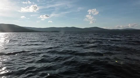 The waters of a mountain lake. Waves Vídeo Stock 64463877