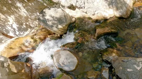 Waters of mountain river flow in cascades among rocks of gorge Stock-Footage 165200164