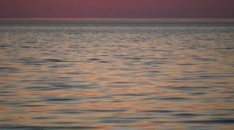 Water's surface reflects the orange sky at dawn (High Definition) Stock-Footage 364977