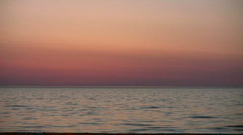 Water's surface reflects the orange sky at dawn (High Definition) Stock Footage 365015