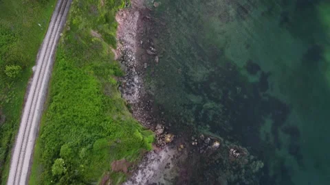 Waterside Park, Devon, England: Drone View: The railway line, cliffs and sea Stock Footage 196626140