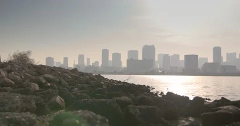 Waterside rocks overlooking Osaka Skyline Vídeo Stock 60997416