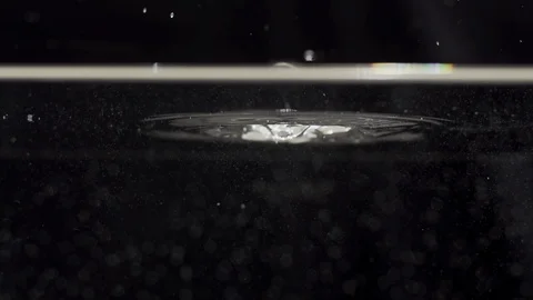 Watersplash surface in slowmotion, drop is falling into water Stock Footage 85799547