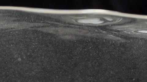 Watersplash surface in slowmotion with lens flare Stock Footage 85810300