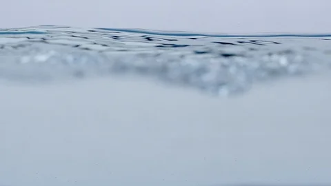 Watersplash surface in slowmotion with small bubbles Stock Footage 85796445