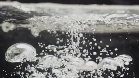 Watersplash surface in slowmotion, water is poured into water Stock Footage 85803635