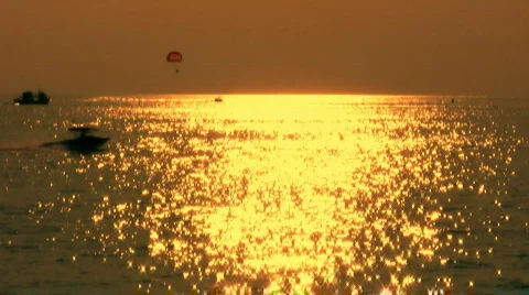 Watersports at sunset 1 Stock Footage
