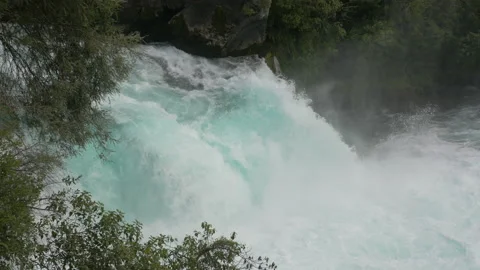 Waterspouts flow from the river in the middle of the forest, in New Zealand Stock Footage 220047716