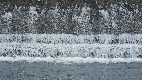 Waterwall on the river in sunshine Stockbeeldmateriaal 153282654