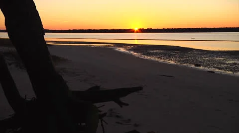 Waterway sunset, sunset dips, 12fps Stock Footage 24464582